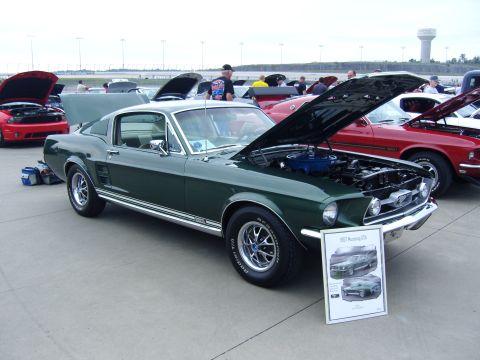 2007 Ford Mustang - A classic Mustang is displayed with its hood up at an outdoor car show.