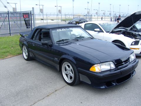 2007 Ford Mustang - Dark blue convertible Mustang with "SALEEN" windshield banner at a car show.
