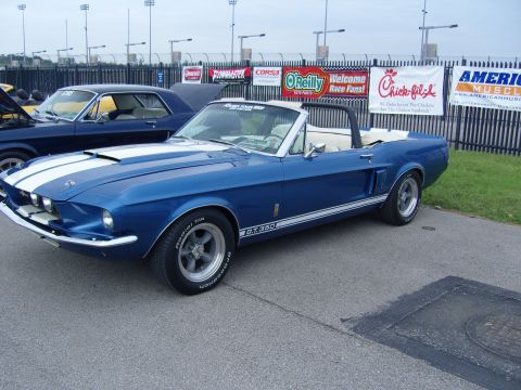 2007 Ford Mustang - A blue 1967 Ford Mustang convertible, identified by its G.T. 350 badging, is parked at an outdoor event.