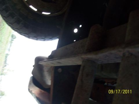 1979 Ford F-150 - Close-up of truck undercarriage, including a tire and frame components. Date stamp indicates 09/17/2011.