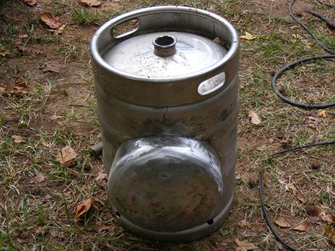 1978 Ford Bronco - A metal beer keg has been modified with a welded section and is shown outdoors on grass.