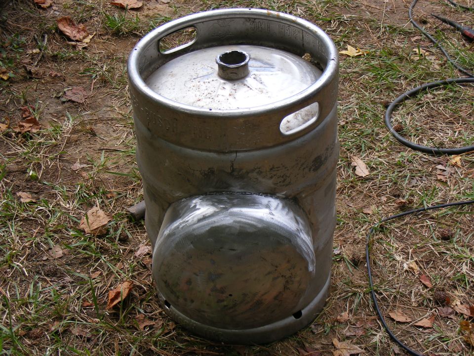 Modified beer keg with welded section, outdoors