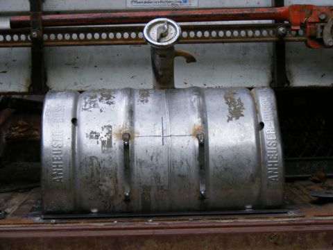 1978 Ford Bronco - A repurposed beer keg serves as a fuel tank, welded and mounted within a vehicle's cargo area.