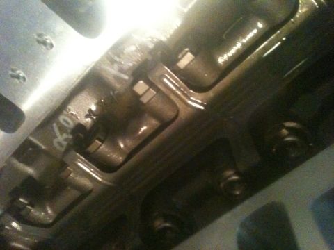 1993 Ford Bronco - Close-up of an engine component, showing internal details and some markings.