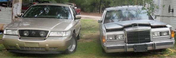 2000 Mercury Grand Marquis and a Lincoln Town Car parked in a grassy area