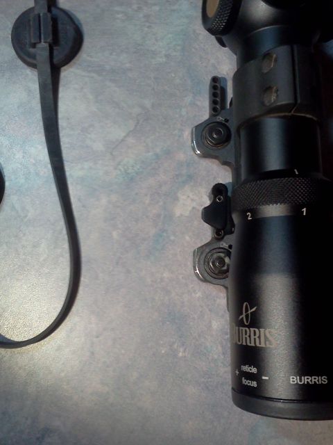 1996 Ford Bronco - A close-up view of a black Burris gun scope, showing its focus and reticle adjustment features.