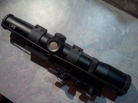 1996 Ford Bronco - A black rifle scope with LRS marking is shown mounted on a bracket.