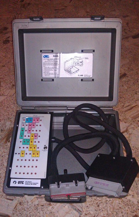 1990 Ford Bronco - OTC 3225 diagnostic tool kit, includes various cables and connector blocks for vehicle diagnostics.