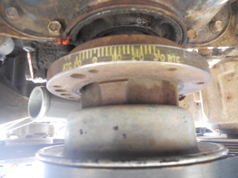 1991 Ford Bronco - Engine crankshaft pulley shows timing marks and degree indicators for engine tuning.