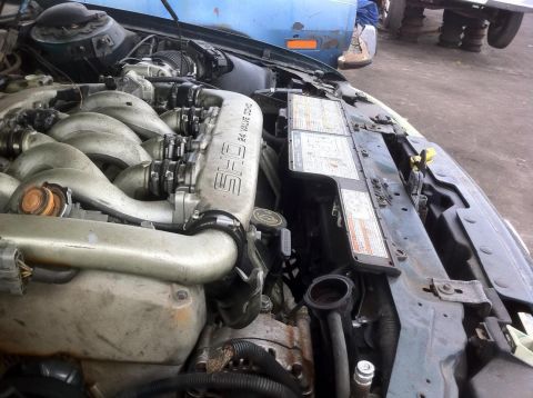 1992 Ford Bronco - Engine bay detail with SHO 24 valve DOHC engine and radiator visible.