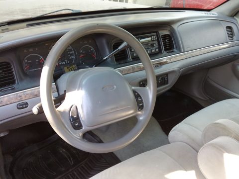 1998 Ford Crown Victoria - Interior view of a 1998 Ford Crown Victoria, the dashboard and steering wheel.