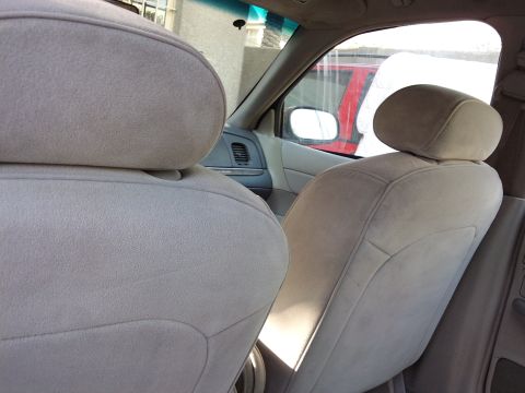 1998 Ford Crown Victoria - Interior view of a 1998 Ford Crown Victoria, showing the front seats and dashboard.