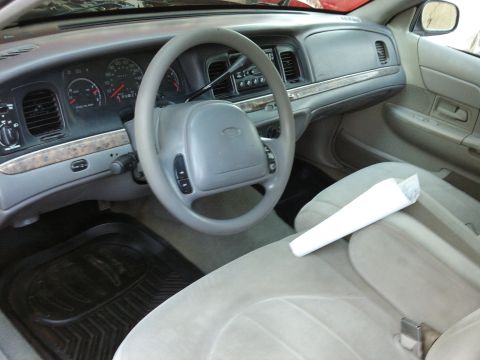 1998 Ford Crown Victoria - Interior view of a 1998 Ford Crown Victoria, including the dashboard and seats.