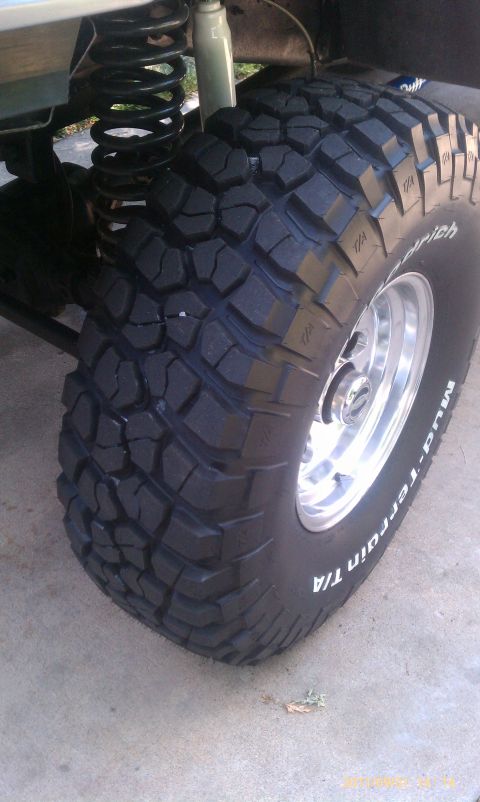 1994 Ford Bronco - A close-up view of a BFGoodrich Mud-Terrain T/A tire and suspension system.