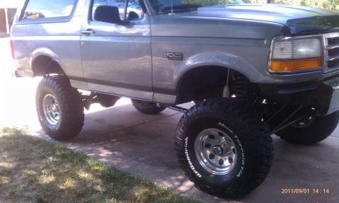 1994 Ford Bronco - This lifted Ford Bronco has a custom suspension and large off-road tires.
