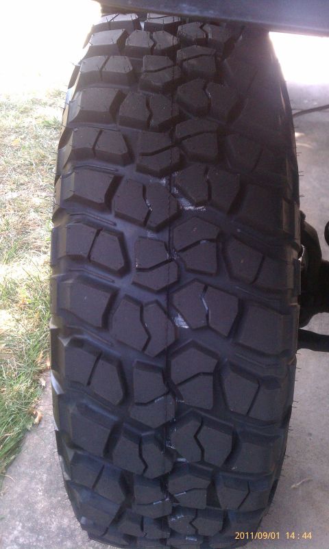 1994 Ford Bronco - A close-up view of an aggressive off-road tire, highlighting its tread design.