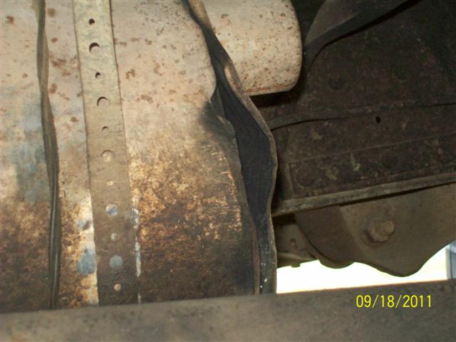 Underbody view of vehicle frame and exhaust pipe