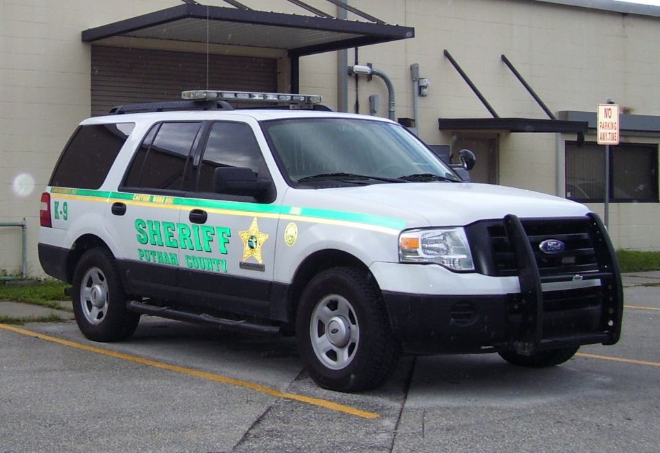 White Ford Expedition SUV with "SHERIFF PUTNAM COUNTY" markings and K-9 designation