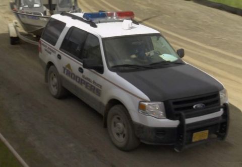2006 Ford F-150 - Alaska State Troopers SUV towing a boat on a trailer.
