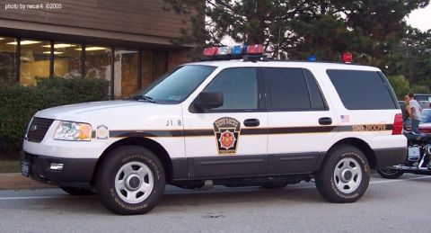 2006 Ford F-150 - This Pennsylvania State Police SUV is marked with official insignia and emergency lights on its roof.
