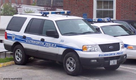 2006 Ford F-150 - Ellsworth Police SUV with blue light bar parked next to another police vehicle.