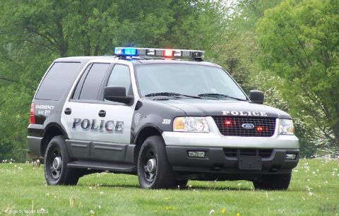 2006 Ford F-150 - This Ford Expedition police vehicle has 'POLICE' written on its side and front grille.