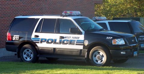 2006 Ford F-150 - A West Fargo police SUV is parked next to another police vehicle.