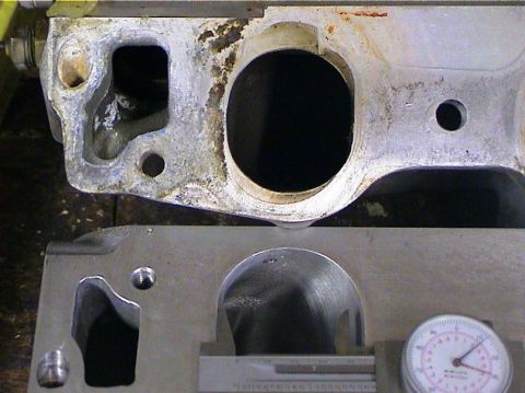 1979 Ford Bronco - Close-up of engine cylinder head and intake manifold components, with measurement tool.