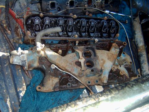 1982 Ford Bronco - Close-up view of a disassembled engine, revealing internal components and signs of wear.