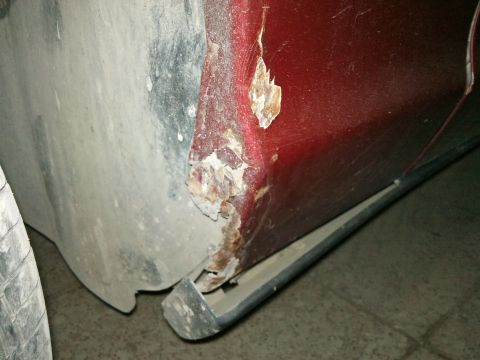 1998 Ford Crown Victoria - Rust has eaten away at the lower rear quarter panel of this 1998 Ford Crown Victoria.