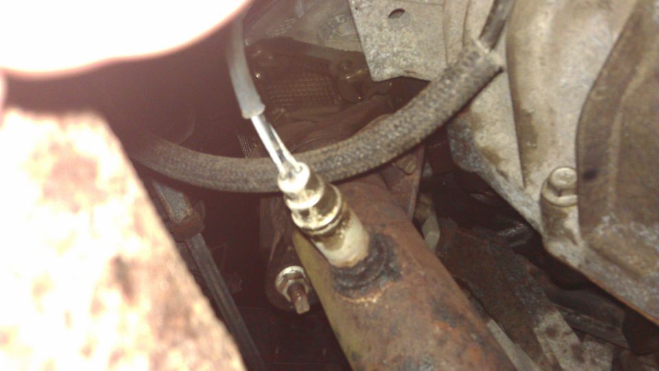 Exhaust pipe with oxygen sensor, close-up view