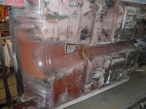 1973 Pontiac Trans Am - Undercarriage of a vehicle undergoing restoration, showing structural components.