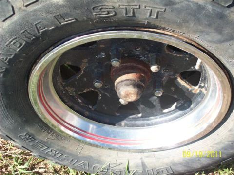 1979 Ford F-150 - Close-up of a wheel and tire, showing the hub and lug nuts. Date stamp indicates 09/19/2011.