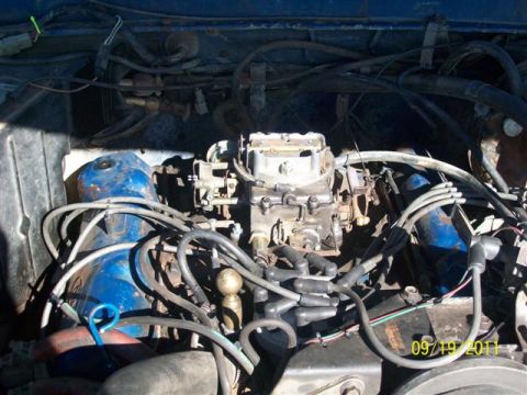 1979 Ford F-150 - Close-up view of an engine bay, a carburetor and numerous spark plug wires. The image includes a date stamp from 2011.