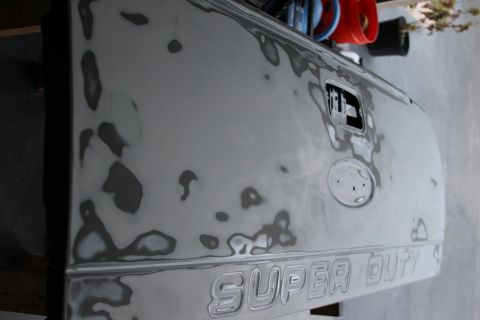 2006 Ford F-350 - This tailgate is being prepped for paint, showing areas of body filler.