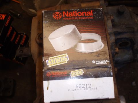 1982 Ford F-100 - A box of National Wheel-End Components, part number 99212, is shown with other automotive parts in the background.