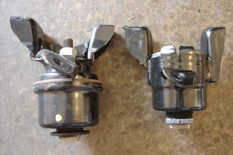 2006 Ford Fusion - Two engine mounts are shown, one with a bolt and wingnut, the other appears to be a replacement part.