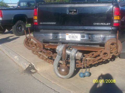 1989 Ford Bronco - This Chevrolet Silverado features a unique, heavy-duty tow hitch constructed from large chains and shackles, with an Indiana license plate…