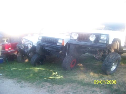 1989 Ford Bronco - Multiple modified Jeep Cherokees are parked on a grassy area, with a date stamp of 09/01/2008.