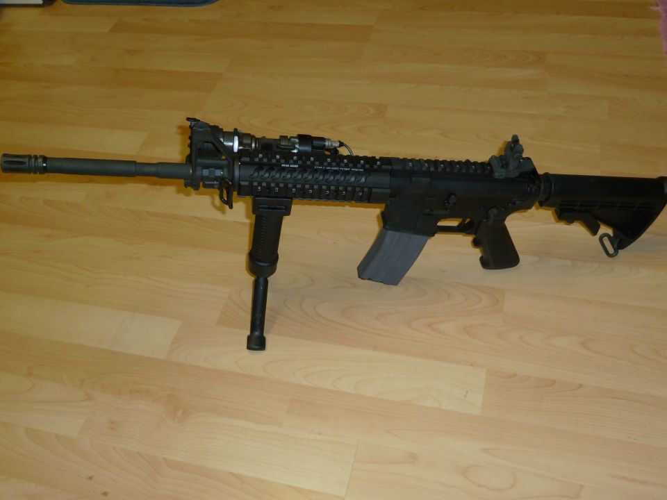 Assault rifle with bipod and extended magazine