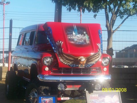 1989 Ford Bronco - Customized 1955 Chevrolet Suburban displayed with patriotic airbrush art on the hood.
