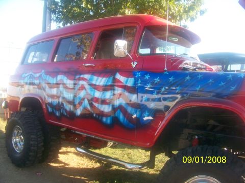1989 Ford Bronco - This lifted SUV features a patriotic American flag paint scheme on its exterior.