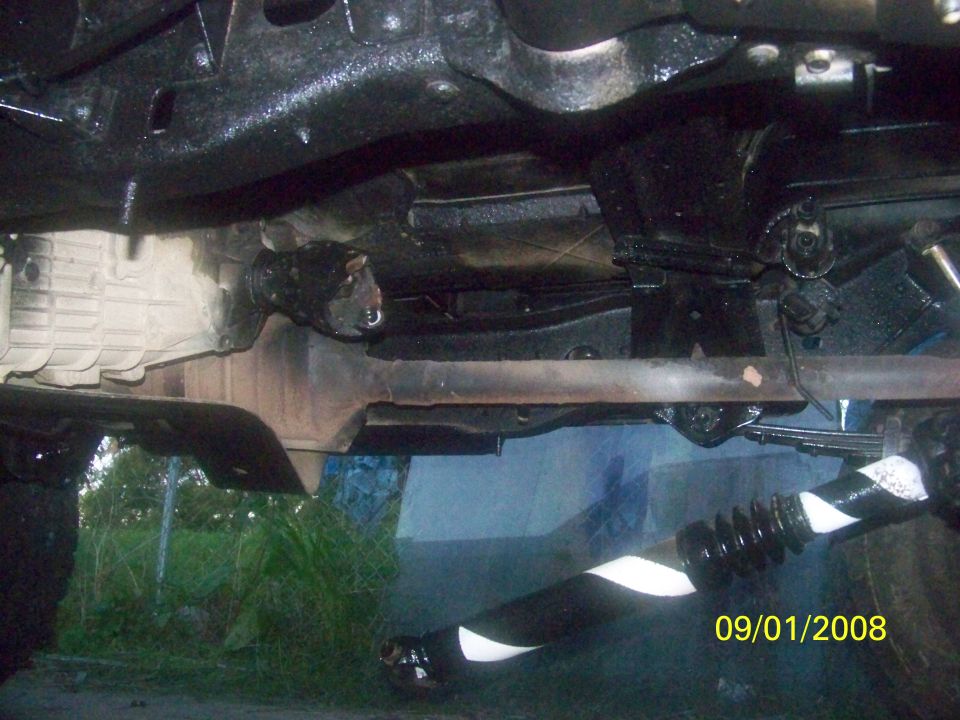 Undercarriage view showing a driveshaft with black and white stripes and a date stamp of 09/01/2008