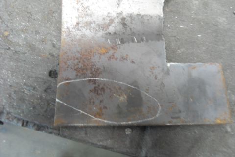 1997 Ford Ranger - Close-up of a metal bracket with chalk markings, likely for fabrication or repair.