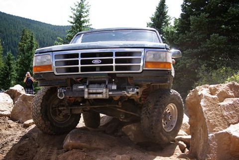 1995 Ford Bronco - This 1995 Ford Bronco navigates a rocky trail, its off-road capabilities with a front winch.
