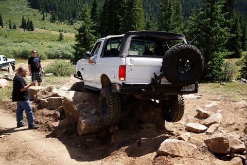 1995 Ford Bronco - 1995 Ford Bronco tackles a challenging rock crawling course in the mountains.