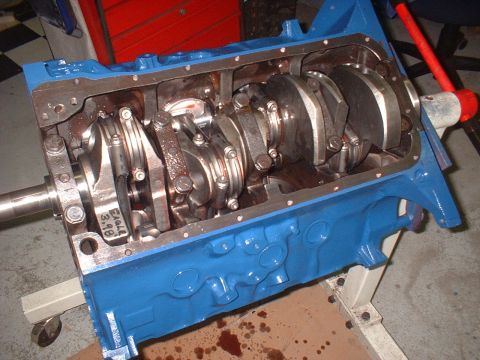 1969 Ford Mustang - Engine block assembly showing crankshaft and connecting rods, with "Eagle 3.98" marked on a rod.