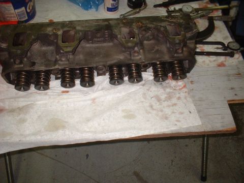 1969 Ford Mustang - A close-up view of an engine cylinder head, showing its internal components and springs.