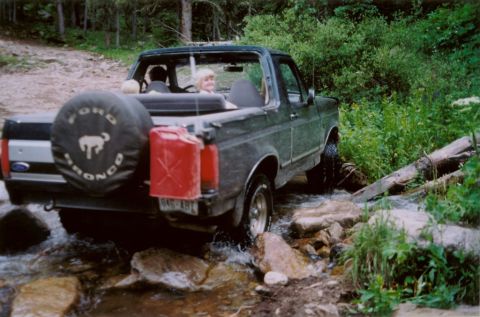 1995 Ford Bronco - This 1995 Ford Bronco navigates a rocky stream, its off-road capabilities.