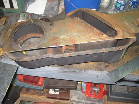 1979 Ford Bronco - This is a close-up view of a worn vehicle heater core housing, showing signs of age and rust.